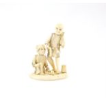 A Japanese Okimono , Meiji Period  Carved Ivory depicting two people  ..9.8 X 7.9cm.