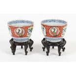 A pair of Japanese Kutani cups , Meiji period with a scalloped rim , painted with cranes and pines .