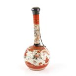 A Japanese Imari Bottle Vase , 19th century with ovoid body and slender neck , painted with floral