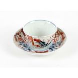 A Chinese Imari Saucer and cup, 18th century (2). The dish is decorated in underglaze blue,
