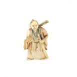 A Japanese Netsuke , Meiji Period, Carved Ivory representing a man holding a sword,. Signed   . 6.