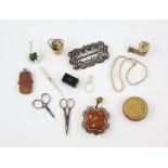 A late Victorian silver buckle, Textile and sewing related items including a bone tape measure,