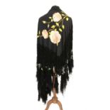 Two early 20th century black silk large fringed shawls together with machine black lace stole and