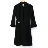 1950s Jean Desses vintage black wool and silk lined coat with tie belt and two black beaded