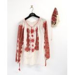 Romanian Peasant blouse profusely embroidered in red and gold thread together with a fine hand