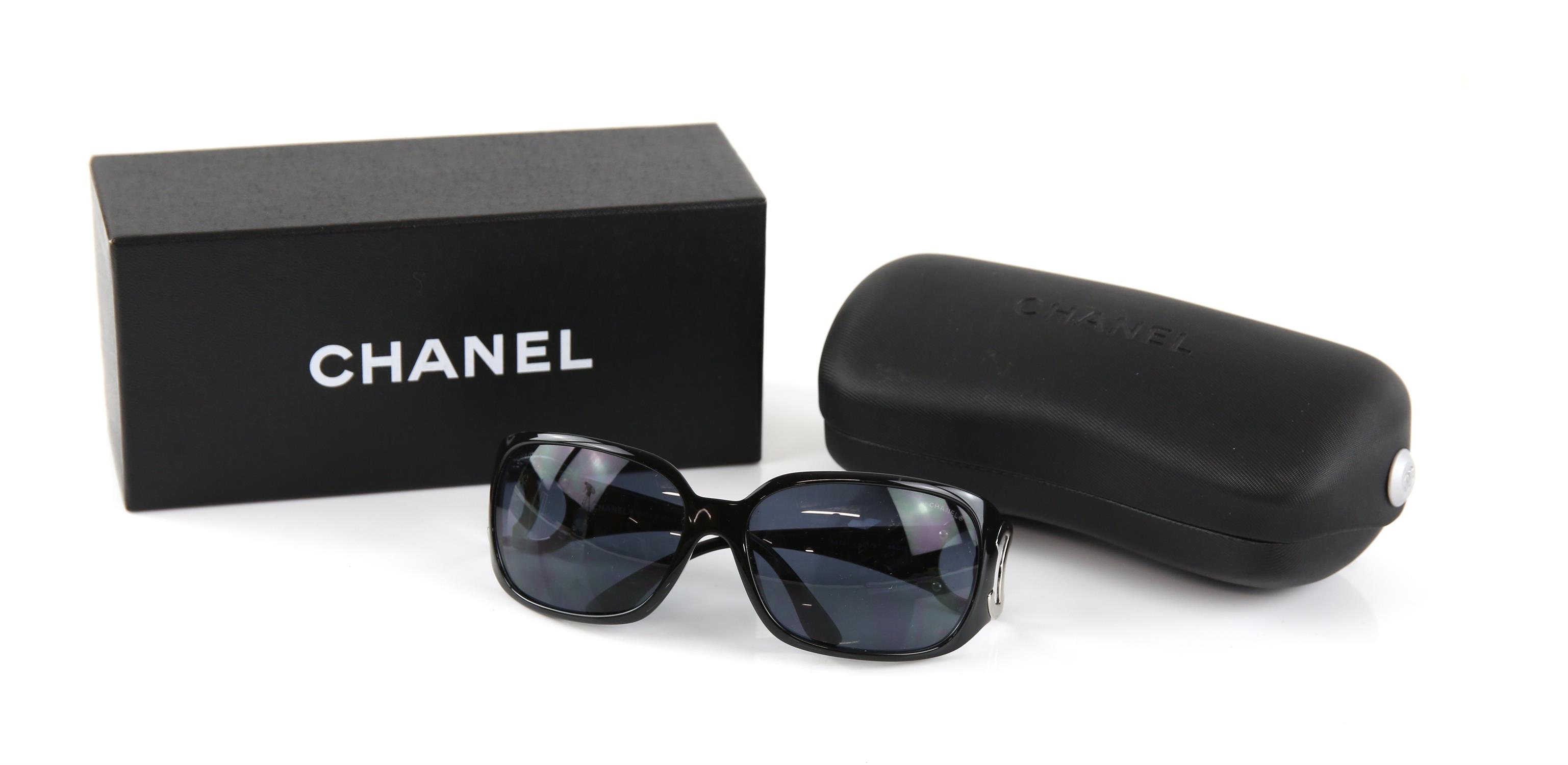Chanel oversized ladies sunglasses, with silver interlaced Cs, cased and boxed with information
