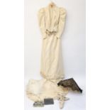 A late 19th early 20th century cream satin Wedding Outfit, comprising a fitted jacket with leg of