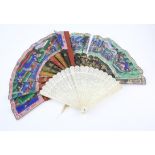 A Cantonese black lacquer and paper fan: the painted paper leaf decorated with figures with ivory