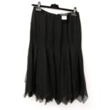 Chanel black silk evening Skirt, 2006, Labelled 06C, size 40, with cut out panels to the lower half