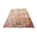 Chinese carpet with scrolling foliage and blossoming flowers on a brown ground, 365 x 272cm