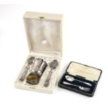 Cased two piece silver christening set by JDS Sheffield 1950 and a continental white metal boxed