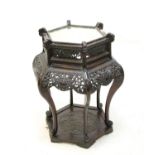 Chinese carved wood jardiniere stand, with hexagonal mirrored top on chrysanthemum carved base with