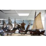 Three wooden model boats to include a galleon, h50cm w57cm (with stand), a sailing boat,