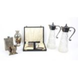 Silver plated items to include epergne, pair of cut glass claret jugs, and a spirit flask,