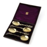Set of four 19th Century Dutch silver figural serving spoons in fitted case, each spoon cast with a