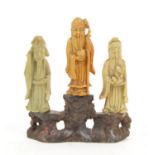 Three Chinese soapstone figures of the Immortals on naturalistic soapstone base, h18cm w16cm