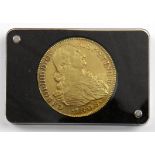 A cased Spanish gold 8 escudos coin 1808 of Charles IV, 26.6 g in weight, 35.5 mm in diameter,