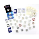 A collection of 37 British 1 ounce, £2 silver Britannia coins of various dates, mostly in capsules