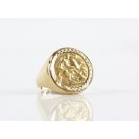 A half sovereign gold ring (1907) in a 9 ct mount, total weight 7.8g.