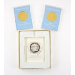 Three Peace Medals, two are cased 1987 United Nations peace medals in plated 18 ct yellow gold,