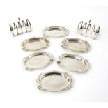 Set of six silver ashtrays, 10 cm wide, Chester 1929, and a pair of toast racks, by Asprey,