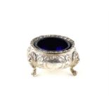 Victorian round silver salt cellar by Robert Hennell London 1862, embossed floral decoration and