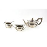 Edward VII three piece silver compressed oval tea service by George Nathan & Ridley Hayes,