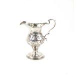 Georg III silver cream jug, punched border, shaped handle, with embossed decoration,