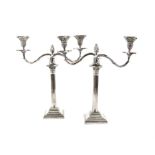 Pair of silver plated Corinthian column twin-light candelabra on stepped square bases, 46cm high,