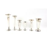 Five weighted silver vases, various sizes 13 -20 cms high and another silver plated