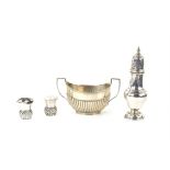 Pair of silver thistle pepper pots, a two handled silver sugar bowl and a modern silver caster,