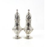 Pair of Edward VII spiral fluted silver sugar castors each with a blank cartouche by S W Smith & Co