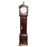 An Early 19th century eight-day mahogany longcase clock, the fret carved hood with brass ball