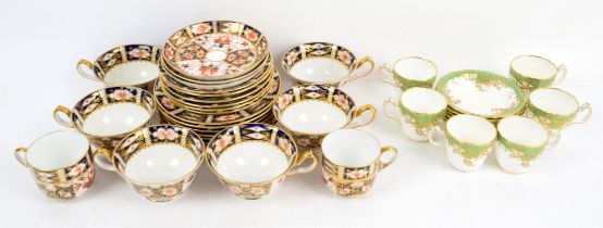 Set of six Royal Crown Derby Imari pattern tea cups and saucers, eight similar side plates,