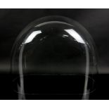 Three glass domes of various sizes, largest 53cm wide,