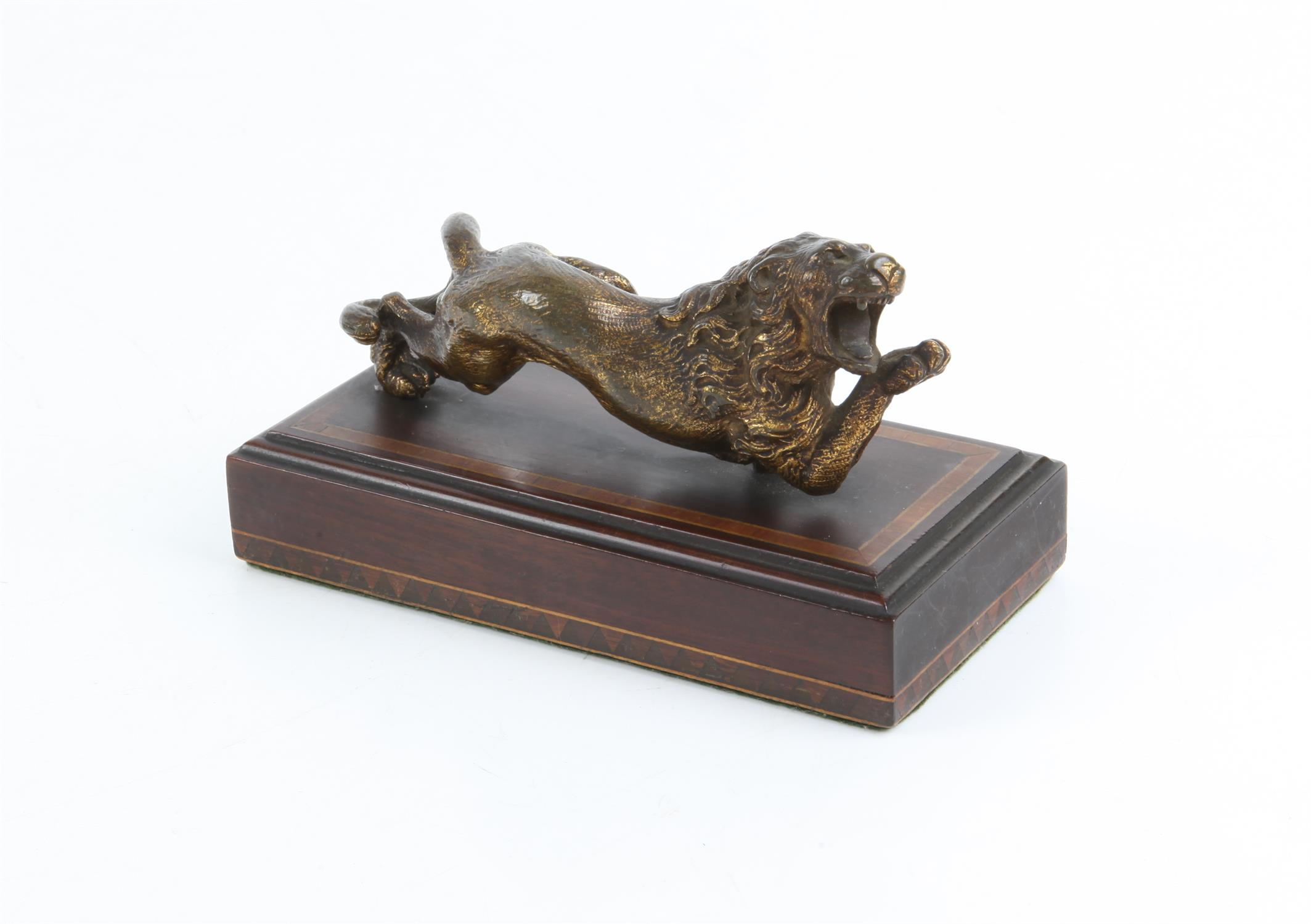 19th century gilded bronze figure of a lion on a crossbanded mahogany base, H9 W15 D7.5 cm