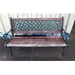 Green cast iron and teak garden bench, the lattice back over scroll arms and legs, H77 W128 cm