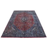 Persian Mashad Carpet with red ground Floral Medallion design, 383 x 290 cms