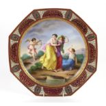 Vienna porcelain octagonal plate, painted with a Classical scene of three maidens and cupid firing