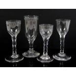 Four 18th/19th century drinking glasses, two with engraved bowls, all with faceted stems,