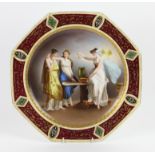 Vienna porcelain octagonal plate, painted with a Classical scene of two maidens and a fairy holding