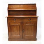 A mid Victorian mahogany chiffonier, the raised back with a single shelf over a long frieze drawer