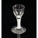 18th century cotton twist drinking glass on round foot, 12cm high,