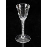 18th century air twist drinking glass with spiral form spotted bowl on round foot, 17cm high,