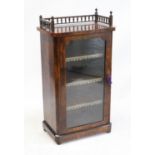 AMENDED DESCRIPTION - Mid-Victorian burr walnut music cabinet, the gallery top over a glazed door