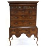 19th century oak chest on stand, the moulded cornice above frieze drawer, two short drawers and