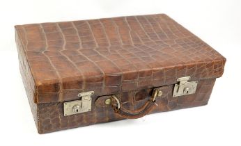 Indian Crocodile leather suitcase, labelled inside 'Makers The North West Tannery Co.