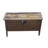 18th century oak coffer, of plank construction, with hinged top and ogee arched sides,