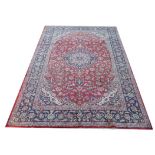 Washed red ground Persian Najafabad carpet from the Isfahan region, 350 x 250 cms