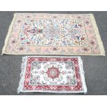Persian wool and silk mix rug, with medallion and vase of flowers on an ivory field filled with